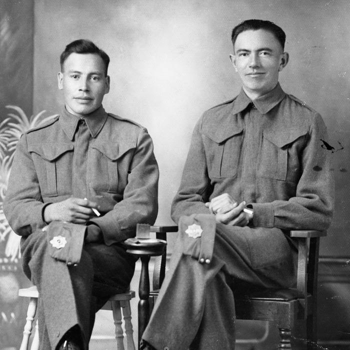 Two men pose for a portrait