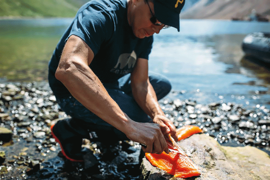 Man cleaning a fish in Nunatsiavut