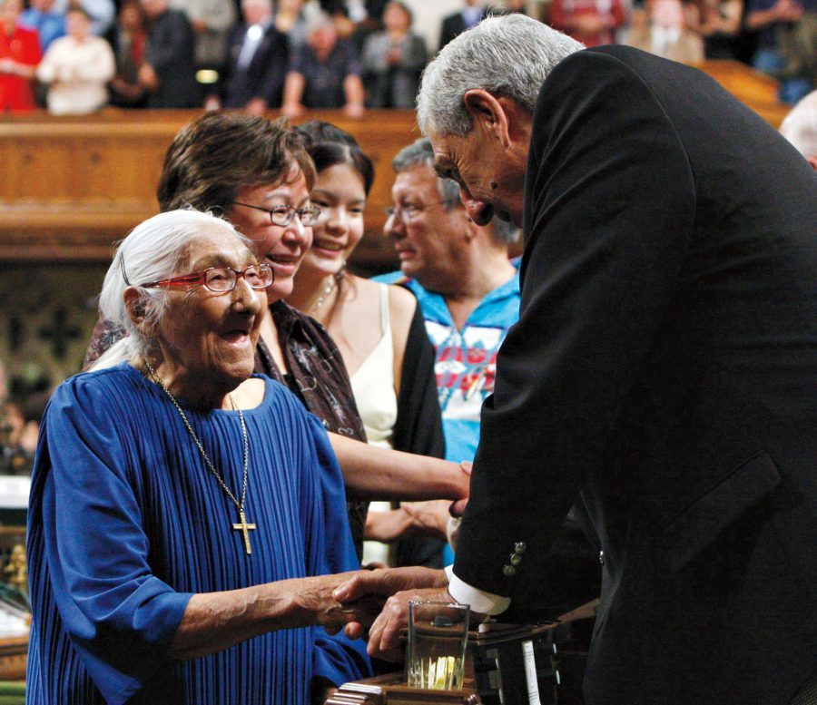 The then-oldest surviving residential school victim, Wabano Marguerite, is greeted in the House of Commons on June 11, 2008, during the federal government’s apology for residential schools.
