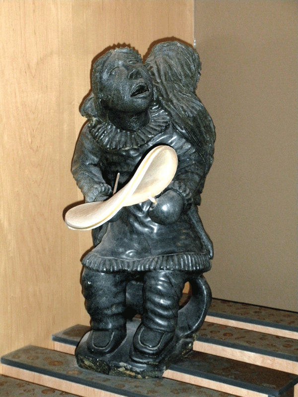 Drum dancer carving made from stone and bone, Inuvialuit Settlement Region.