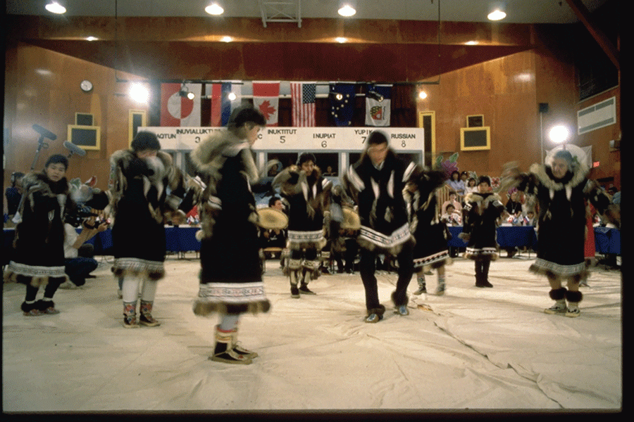 A group of dancers perform in traditional Inuit clothing